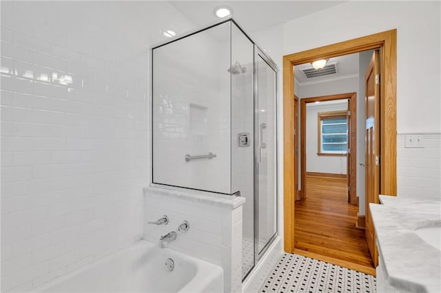 401 Riverdale Dr, Jefferson, LA 70121 - full bath featuring a bath, a shower stall, and ornamental molding