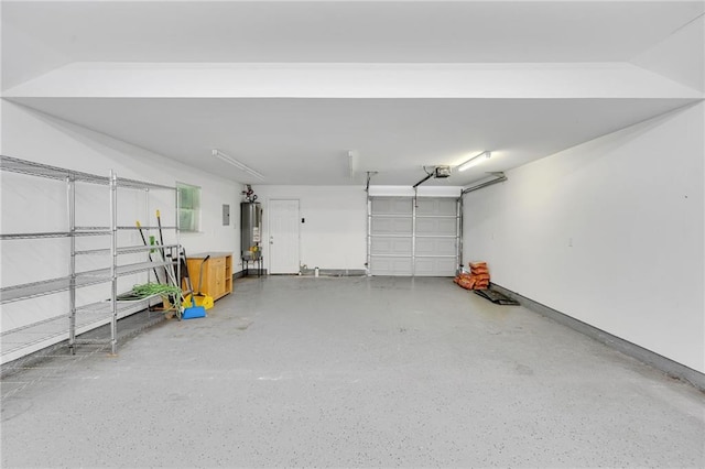 401 Riverdale Dr, Jefferson, LA 70121 - garage with water heater, a garage door opener, and baseboards