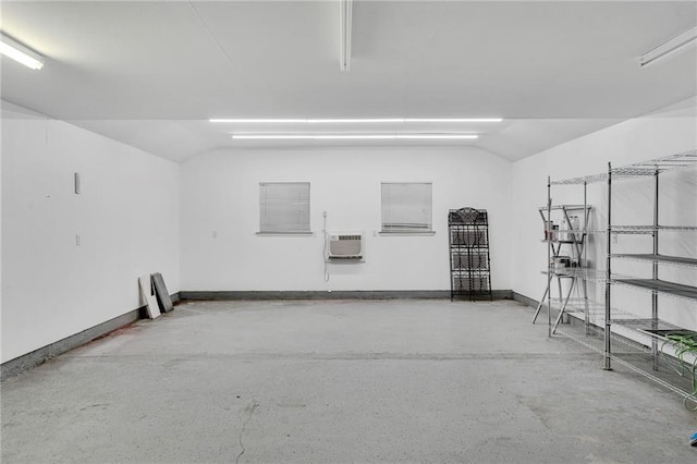 401 Riverdale Dr, Jefferson, LA 70121 - garage with baseboards and a wall mounted air conditioner