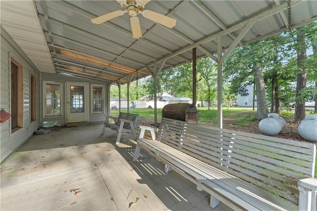 wooden terrace featuring ceiling fan