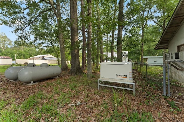 view of yard with fence and view of scattered trees