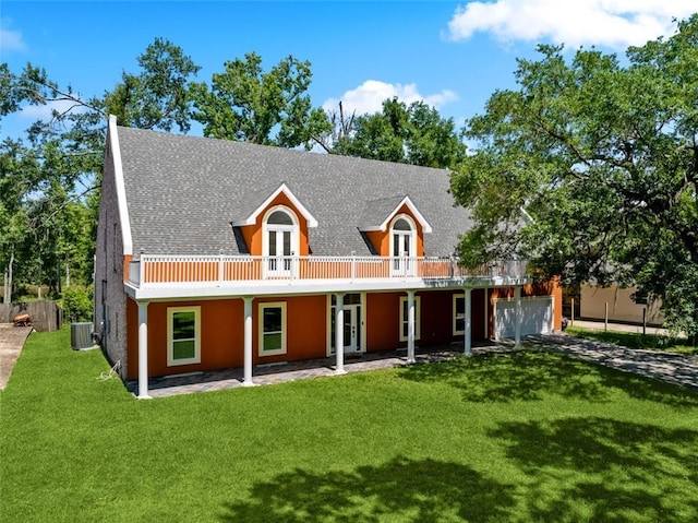 436 Nighthawk Dr, Slidell, LA 70461 - view of front of house with french doors, central air condition unit, a front lawn, driveway, and roof with shingles