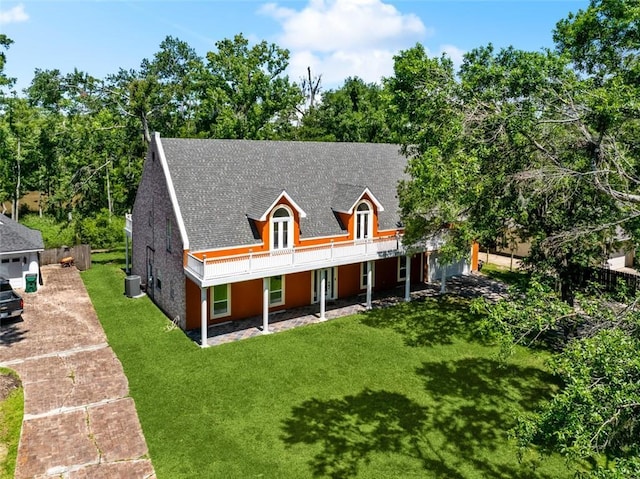 436 Nighthawk Dr, Slidell, LA 70461 - view of front facade featuring a front lawn, cooling unit, a deck, a shingled roof, and french doors