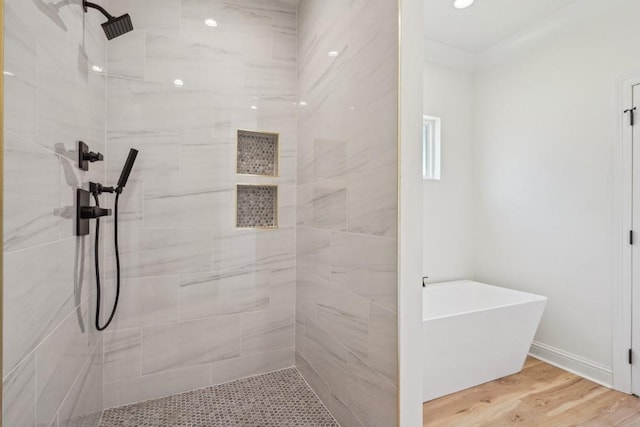 342 W Ave, Harahan, LA 70123 - full bath featuring tiled shower, a freestanding bath, and wood finished floors