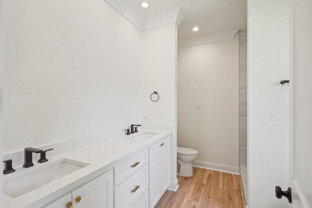 342 W Ave, Harahan, LA 70123 - full bath with toilet, wood finished floors, recessed lighting, double vanity, and baseboards