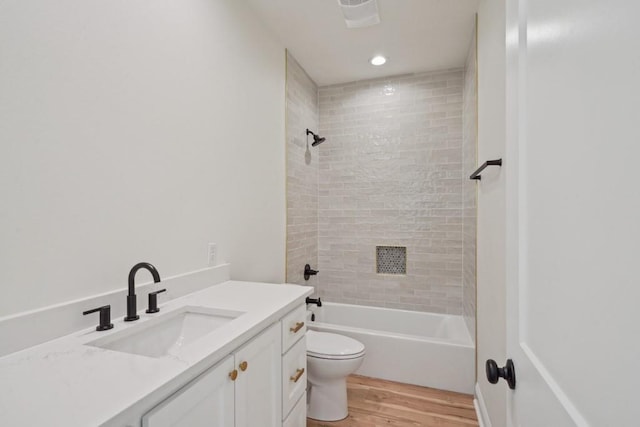 342 W Ave, Harahan, LA 70123 - full bathroom featuring toilet, wood finished floors, vanity, shower / washtub combination, and recessed lighting