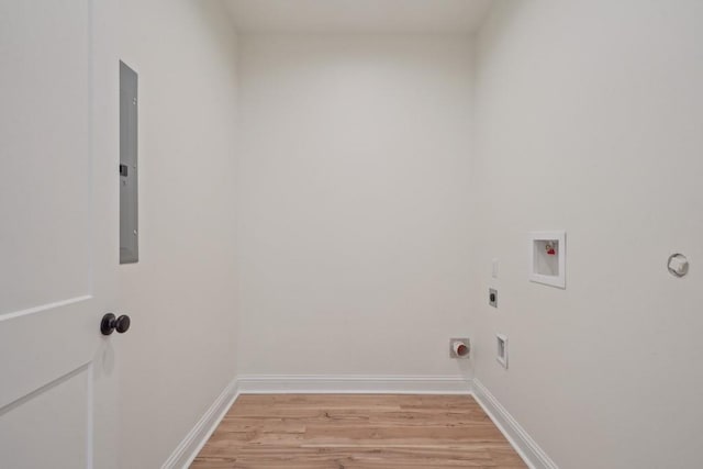 342 W Ave, Harahan, LA 70123 - laundry area featuring light wood-style floors, electric dryer hookup, hookup for a washing machine, and baseboards