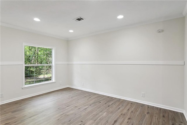 25512 W Spruce St, Lacombe, LA 70445 - empty room with ornamental molding, wood finished floors, baseboards, recessed lighting, and a smoke detector
