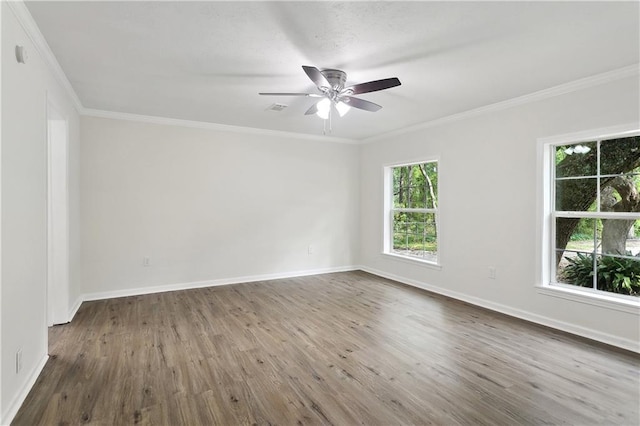 25512 W Spruce St, Lacombe, LA 70445 - unfurnished room with healthy amount of natural light, wood finished floors, ceiling fan, baseboards, and ornamental molding