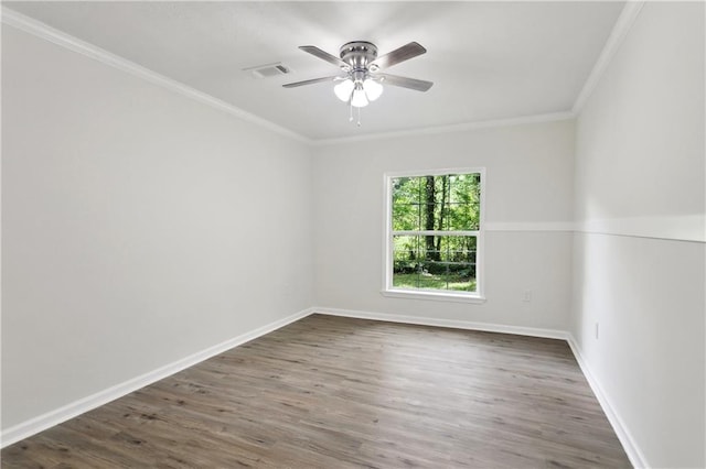 25512 W Spruce St, Lacombe, LA 70445 - spare room with ornamental molding, a ceiling fan, wood finished floors, and baseboards