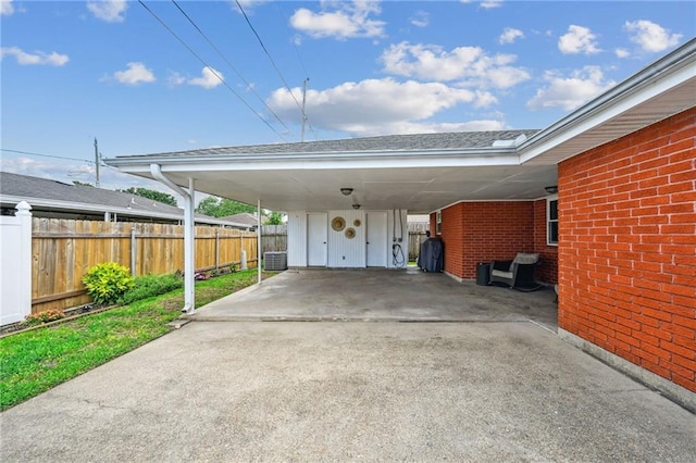 1513 Belmont Pl, Metairie, LA 70001 - view of parking with fence, driveway, and an attached carport