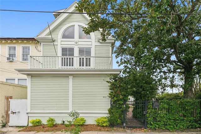 1612 Milan St, New Orleans, LA 70115 - view of home's exterior featuring a gate, a balcony, and fence