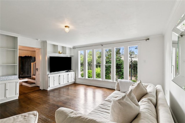 1612 Milan St, New Orleans, LA 70115 - living room featuring crown molding, dark wood finished floors, and built in shelves