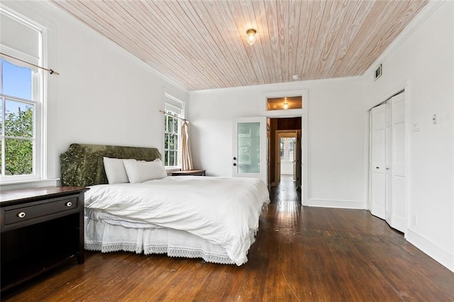 1612 Milan St, New Orleans, LA 70115 - bedroom with crown molding, wood ceiling, and dark wood-type flooring