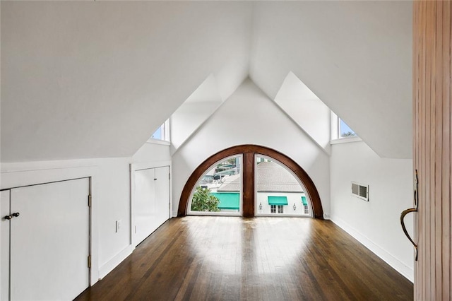 1612 Milan St, New Orleans, LA 70115 - additional living space with healthy amount of natural light, wood finished floors, baseboards, and high vaulted ceiling