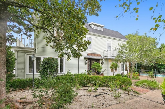 1612 Milan St, New Orleans, LA 70115 - view of front facade with fence and a balcony