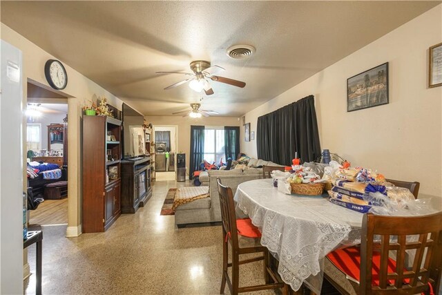 521 S Alexander St, New Orleans, LA 70119 - dining area featuring ceiling fan, dark speckled floor, and baseboards