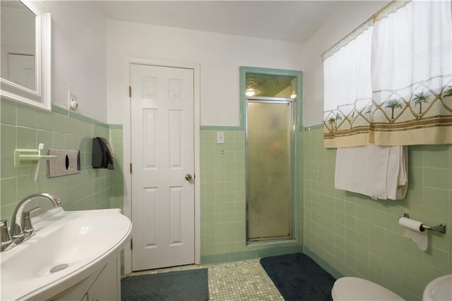 521 S Alexander St, New Orleans, LA 70119 - full bathroom with tile walls, a stall shower, tile patterned flooring, toilet, and wainscoting