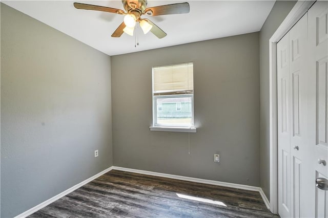 2603 Huey P Long Ave, Gretna, LA 70053 - unfurnished bedroom featuring a closet, dark wood finished floors, baseboards, and ceiling fan
