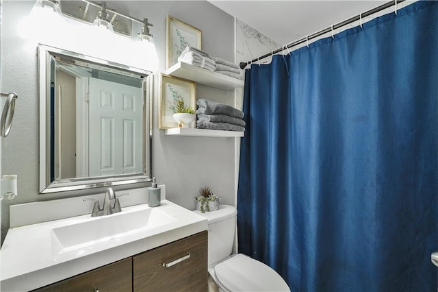 2603 Huey P Long Ave, Gretna, LA 70053 - bathroom featuring toilet, vanity, and curtained shower