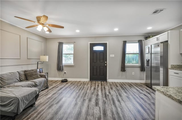 2603 Huey P Long Ave, Gretna, LA 70053 - living area featuring wood finished floors, baseboards, crown molding, ceiling fan, and recessed lighting