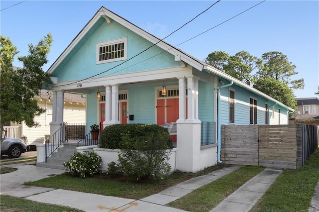 7715 Panola St, New Orleans, LA 70118 - view of front facade featuring covered porch
