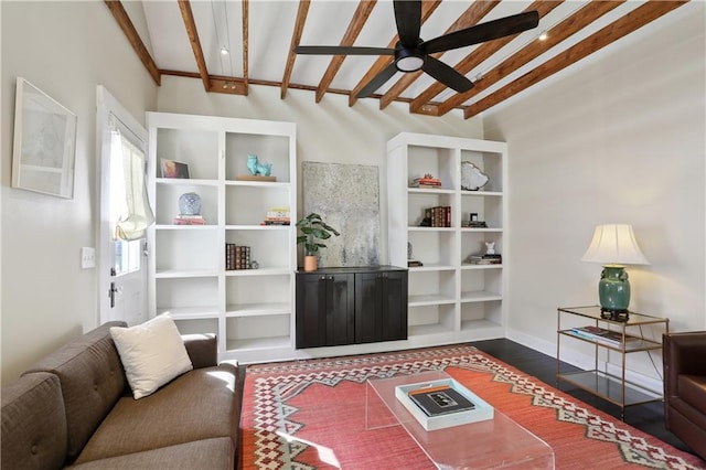 7715 Panola St, New Orleans, LA 70118 - living room with a ceiling fan, dark wood-style flooring, beamed ceiling, and baseboards