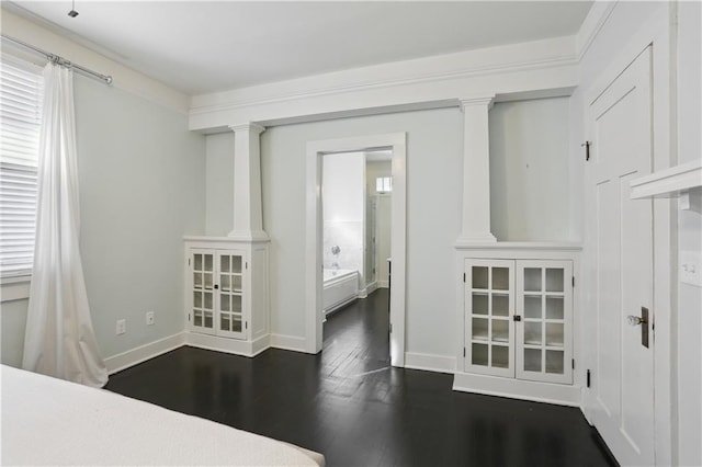 7715 Panola St, New Orleans, LA 70118 - interior space with dark wood-style flooring, plenty of natural light, and ornate columns