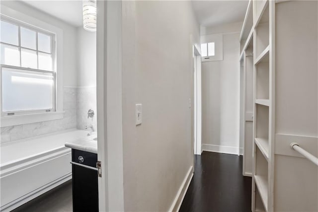 7715 Panola St, New Orleans, LA 70118 - spacious closet with dark wood finished floors
