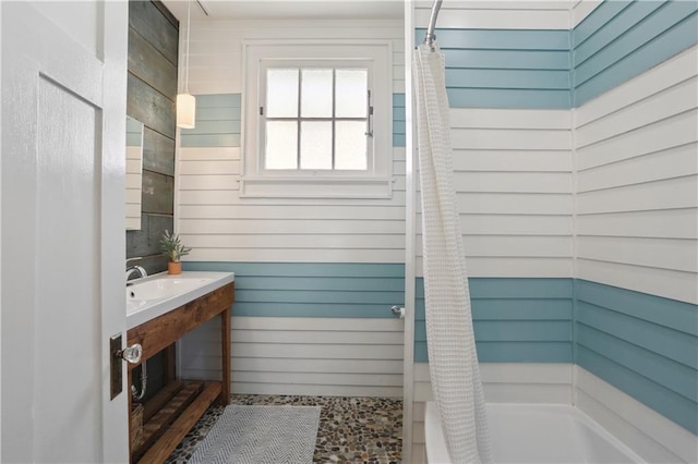 7715 Panola St, New Orleans, LA 70118 - bathroom with wooden walls and a sink