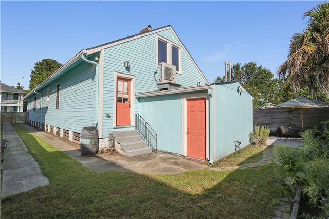 7715 Panola St, New Orleans, LA 70118 - back of property with entry steps, a chimney, ac unit, and an outdoor structure
