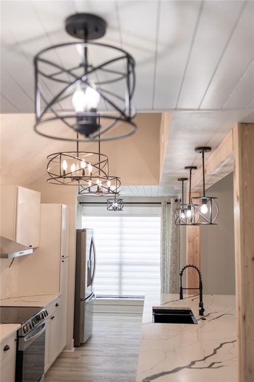 114WCHAMALECOVE W Chamale Cv, Slidell, LA 70460 - kitchen featuring stainless steel refrigerator with ice dispenser, a sink, range with electric stovetop, a chandelier, and light stone counters
