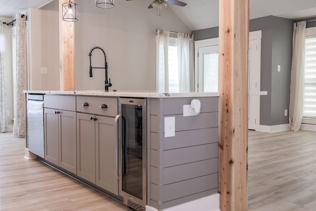 114WCHAMALECOVE W Chamale Cv, Slidell, LA 70460 - kitchen featuring gray cabinets, beverage cooler, ceiling fan, light wood-style floors, and light countertops
