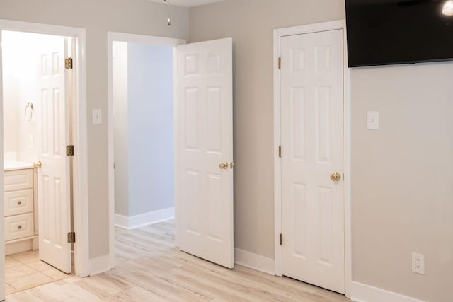 114WCHAMALECOVE W Chamale Cv, Slidell, LA 70460 - unfurnished bedroom with light wood finished floors, baseboards, and ensuite bath