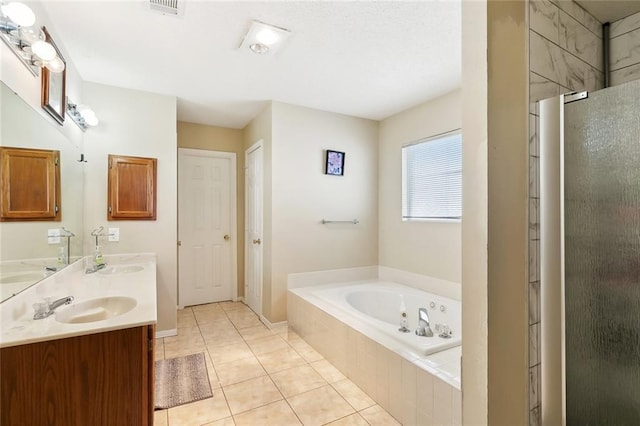 2929 Hudson St, New Orleans, LA 70114 - bathroom featuring a garden tub, tile patterned floors, double vanity, an enclosed shower, and baseboards