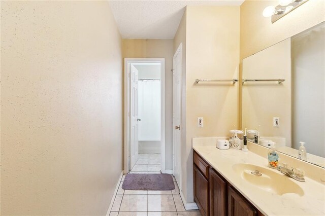 2929 Hudson St, New Orleans, LA 70114 - bathroom featuring tile patterned floors, vanity, and baseboards