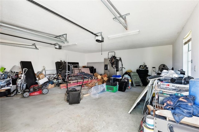 2929 Hudson St, New Orleans, LA 70114 - garage featuring a garage door opener and stainless steel fridge with ice dispenser