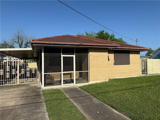 2820 Annette St, New Orleans, LA 70119 - back of property featuring a sunroom and brick siding