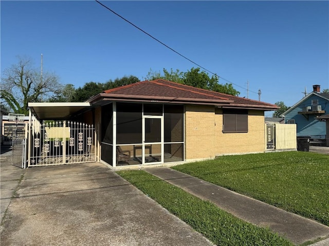 2820 Annette St, New Orleans, LA 70119 - back of house with a sunroom and brick siding