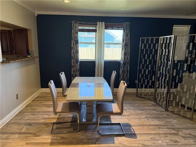 2820 Annette St, New Orleans, LA 70119 - dining space with crown molding, wood finished floors, baseboards, and recessed lighting