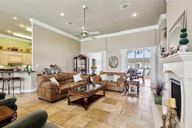 10 Harbor Cv, Slidell, LA 70458 - living room with ceiling fan, ornamental molding, decorative columns, a high ceiling, and recessed lighting