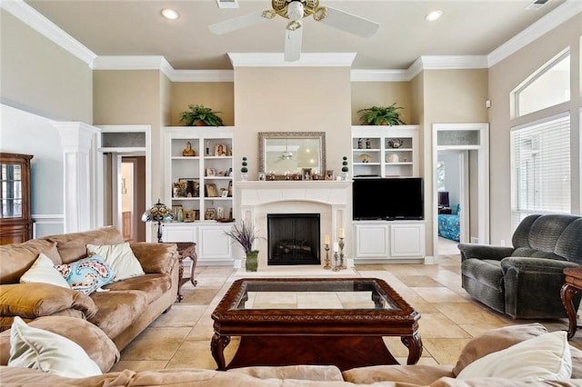 10 Harbor Cv, Slidell, LA 70458 - living area with crown molding, a ceiling fan, a fireplace, light tile patterned flooring, and built in features