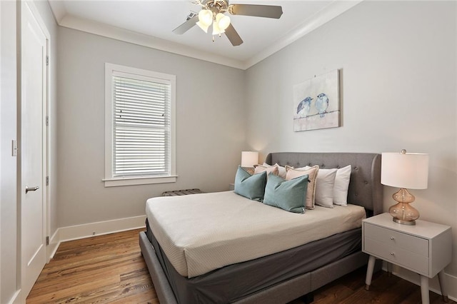 1631 Baronne St, New Orleans, LA 70113 - bedroom featuring wood finished floors, baseboards, ornamental molding, and a ceiling fan