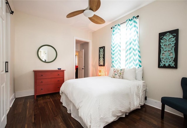 1241 Kerlerec St, New Orleans, LA 70116 - bedroom with baseboards, wood finished floors, and ceiling fan