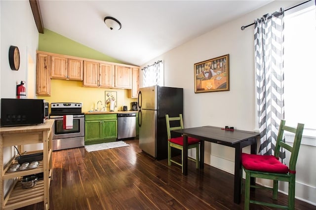 1241 Kerlerec St, New Orleans, LA 70116 - kitchen featuring stainless steel appliances, dark wood finished floors, vaulted ceiling, a sink, and light brown cabinets