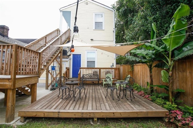 1241 Kerlerec St, New Orleans, LA 70116 - back of house featuring stairway, a wooden deck, and fence
