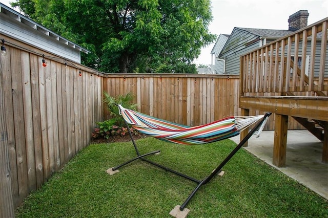 1241 Kerlerec St, New Orleans, LA 70116 - view of yard with a wooden deck and a patio area