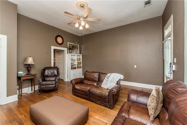 245 E Oak St, Ponchatoula, LA 70454 - living area with a ceiling fan, wood finished floors, and baseboards