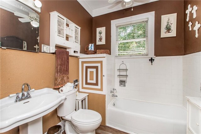 245 E Oak St, Ponchatoula, LA 70454 - full bathroom with ceiling fan, a tub to relax in, toilet, a sink, and ornamental molding