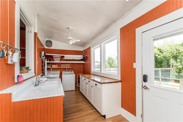 245 E Oak St, Ponchatoula, LA 70454 - kitchen with ceiling fan, white cabinets, healthy amount of natural light, light wood-style floors, and lofted ceiling
